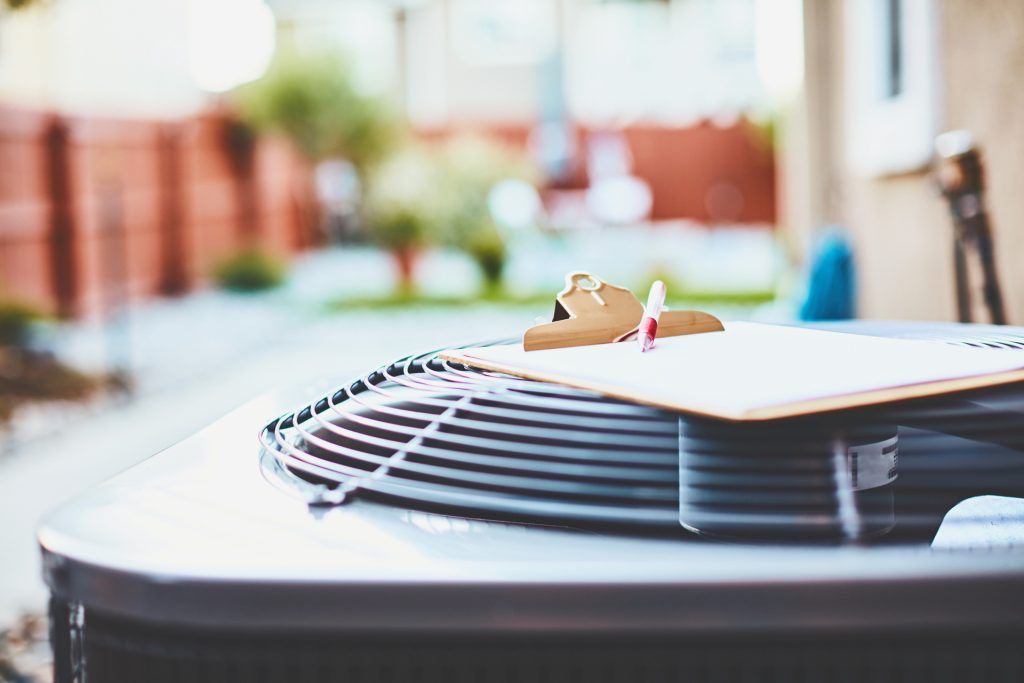 air-conditioning-unit-being-checked