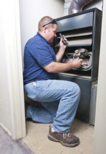 technician-inspecting-furnace